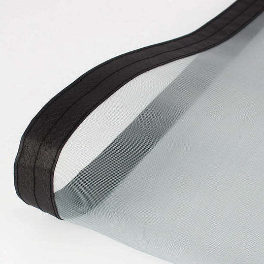 close-up of a fine mesh screen door material with a black reinforced edge